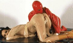 Kinky girl bondaged in rubber straightjacket - Part 1 of 2 - The pumping dildo