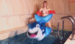 Alla blows off a transparent inflatable seal in the pool!!!