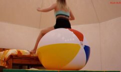 Alla bounces high on a big beach ball and a big fitness ball!!!