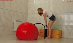 Alla inflates a huge fitness ball with a hand pump and jumps on it!!!