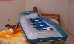 Alla inflates a large rare transparent air mattress with her mouth
