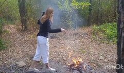 Tearing and burning clothes in the woods