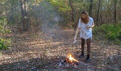 Crazy woman in the woods rips off her clothes and burns them