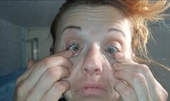A woman plucks out her eyes (eye test)
