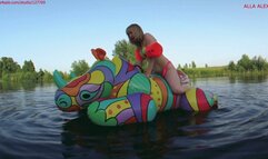 Alla is riding with great pleasure on a big bright squeaky inflatables rhino on the lake!!!
