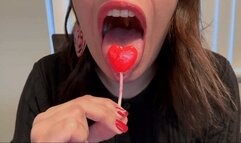 Mistress Alina Crunches on Heart-Shaped Lollipop