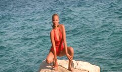 867 Emili Hot short haired model make striptease in ocean