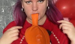 Girl blow orange balloon