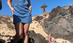 Girl is fingering pussy in front of stranger on the public beach