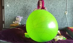 Girl blowing 36inch balloons with pump