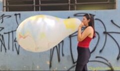 Laura Blows to Pop a 30-Inch Marble South American Balloon