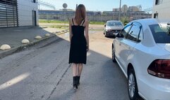 A girl in ankle-high boots walks through deep muddy puddles and a lot of muddy water flows into her boots