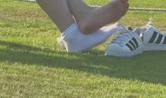 Candid shoeplay in sneakers and socks in public