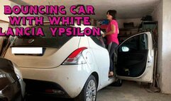 car bouncing with new white Lancia ypsilon car