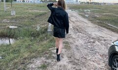 A girl in high-heeled boots walks through very deep mud, mud is poured into the boots and they get wet