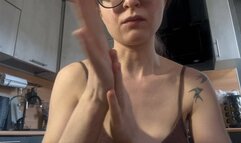 Emma smears cream on her fingers, plays, breaks her hands