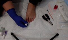 Pedicure and painting toenails while wearing surgical gloves