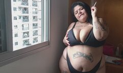 Bbw smoking in her window and masturbating in bed