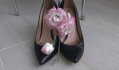 She crushed beautiful flowers with black leather shoes b