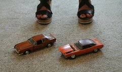 Giantess Charlene destroys and crush 2 plastic toy cars in sexy wedges close up view