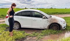 CAR STUCK Ellie got stuck in the mud when she tried to turn around