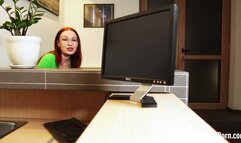 Fucking a redhead behind her working desk