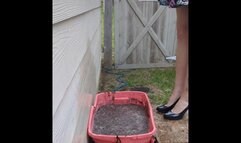 Fifi loses her shiny black patent heels in a container of sticky deep mud