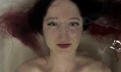 Emma in the bath, close-up face, poet under water - (part 16) operator shoots video