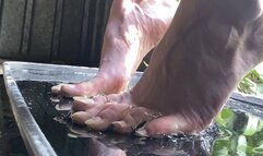 Bare feet stuck in sticky superglue trap