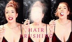 Hair brushing and hair play while smoking