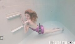 Slut relaxes underwater with vibrator after party