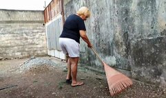 Scratching my itchy feet while sweeping my backyard (1)