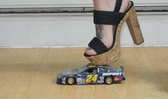 Giantess Atari destroys a hand built NAScar toy car in massive heels ground close view