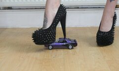 Giantess Atari crushes a Plymouth Barracuda in spiky high heels close up ground view