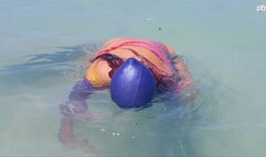 Swimcap and head dunking in the sea