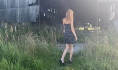 A girl in high-heeled shoes walks through a landfill and holes all objects with her heels (ASMR high heels)