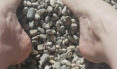 Little rocks between My toes on the beach