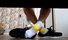 White socks with a yellow heel play with men shoes