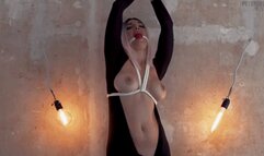 Olga in catsuit is tied to the wall and completely wetting herself in drool mobile version