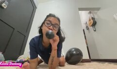 Akina blows up black balloons