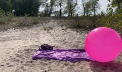 Play on pink shosu ball on beach