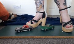 Giantess Jayne crushes a Mercedes and corvette in chunky heels toy car crush low closeup ground view