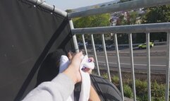 PainfulPleasure Smothers Her Best Friend With Her Stinky Feet Then Gives Him A FootJob On Balcony For Everyone to see