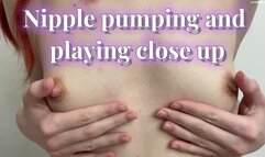 Nipple pumping and playing close up