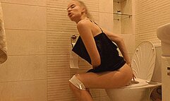 Toilet sexy blondie in a black short dress! MP4