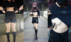 Handcuffs connected to nipple clamps outdoors