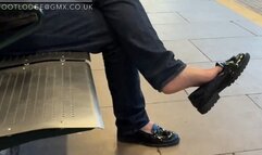 Candid shoeplay and dangling at the train station