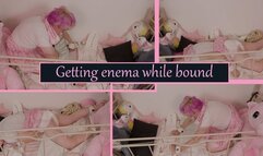 Getting enema and messing my diaper while bound to my crib