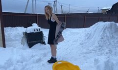 A girl in the -20 frost walks in a light dress and barefoot, she rides down a snow slide (reissue)