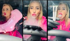 Car hot boxing human ashtray in pink leather, pink boots and gloves